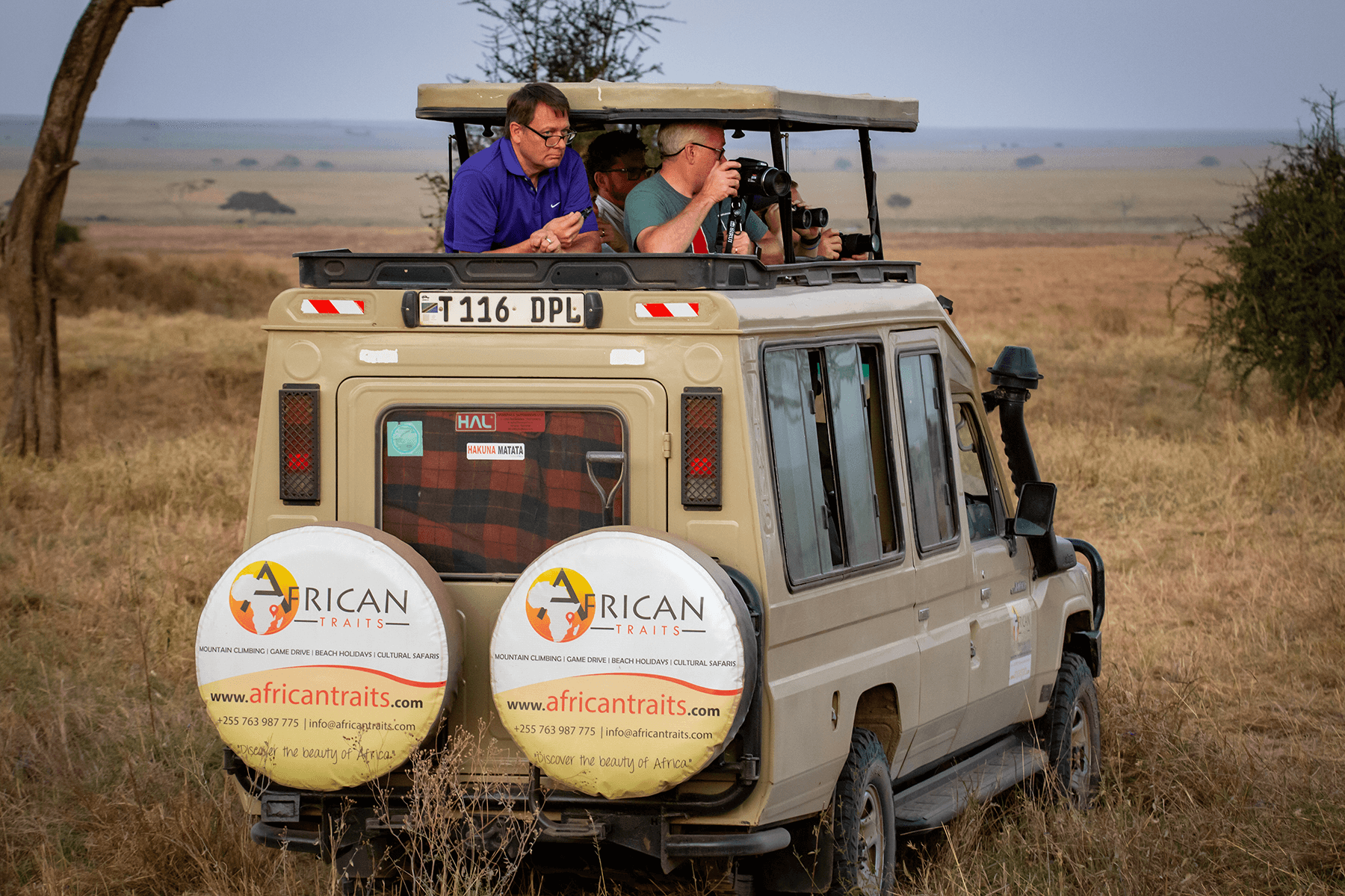 Picture of tourist enjoying on africantraits car
